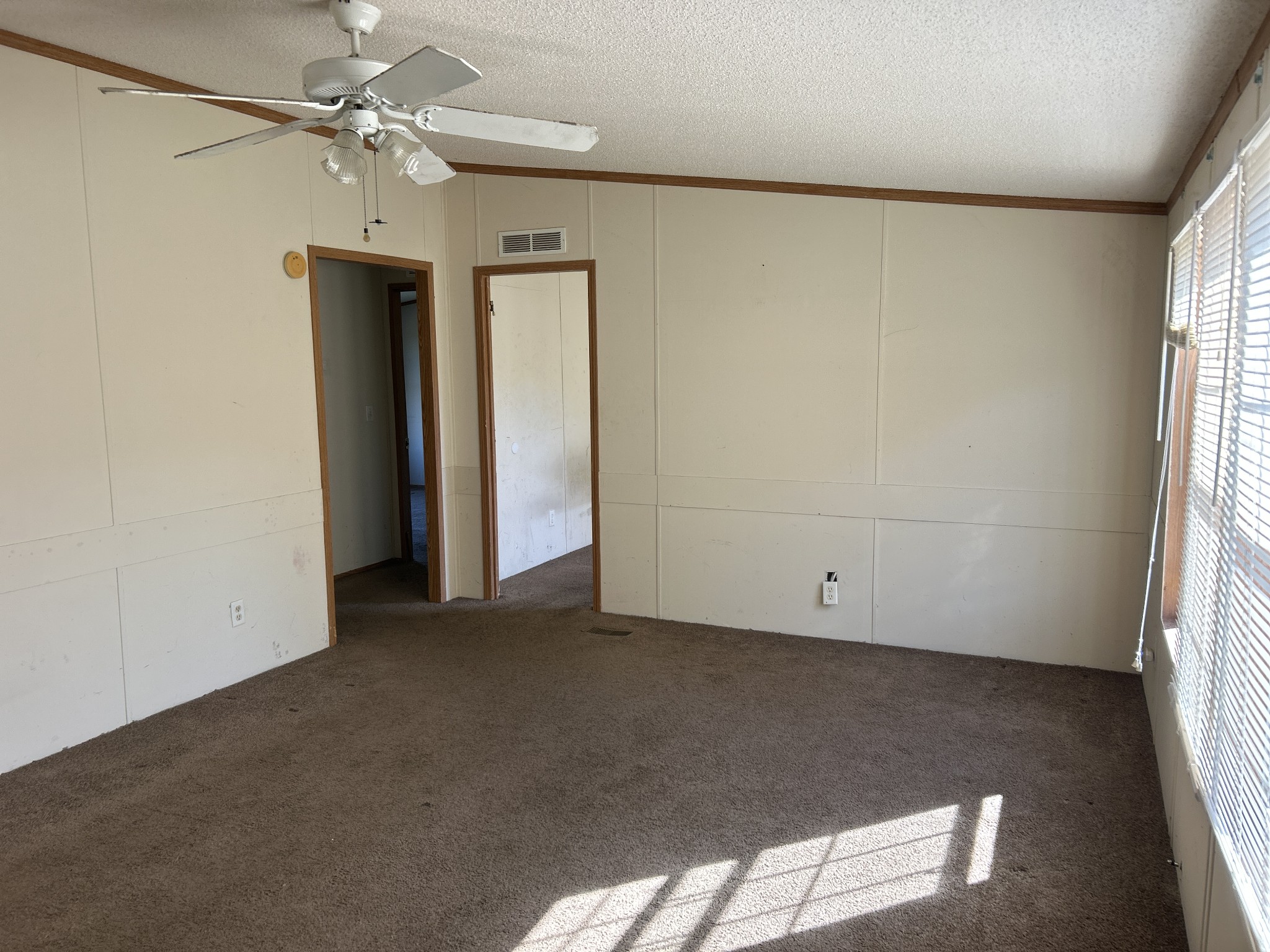 784 Garrison Road Hohenwald, TN 38462 - Photo 24 of 36 an empty room with a window and a ceiling fan