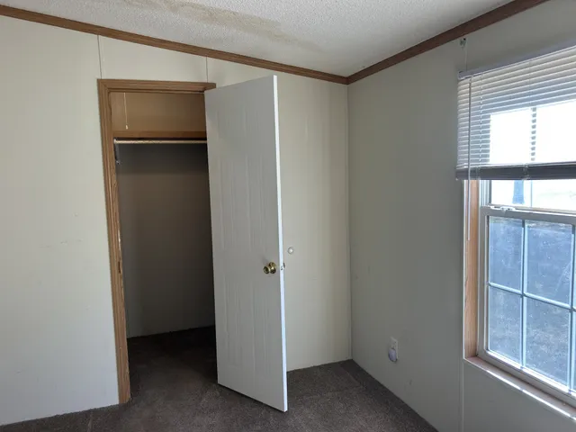 a view of a house with a yard from a tub