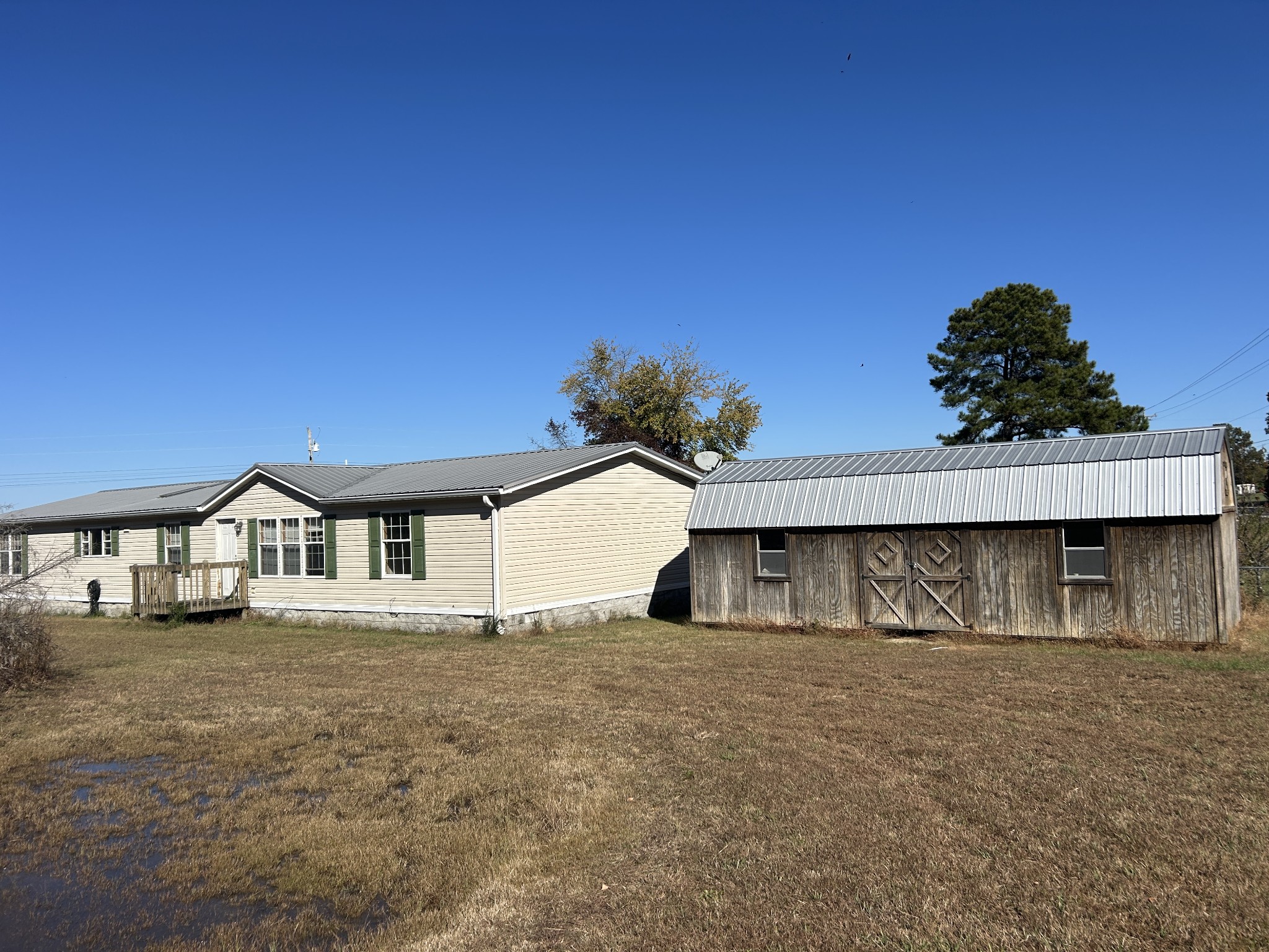 784 Garrison Road Hohenwald, TN 38462 - Photo 4 of 36 a view of a house with a yard