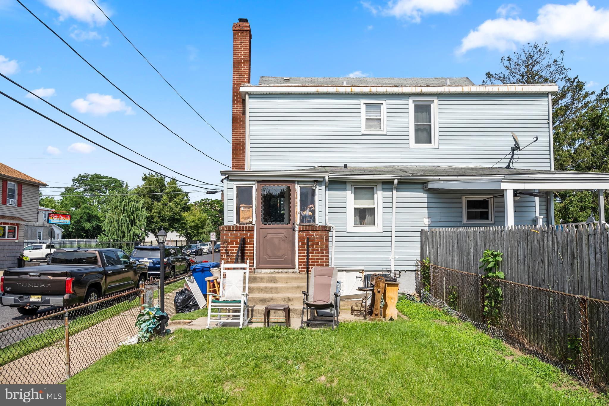 130 Madison Street Riverside, NJ 08075 - Photo 32 of 38 a view of a house with a backyard and chairs