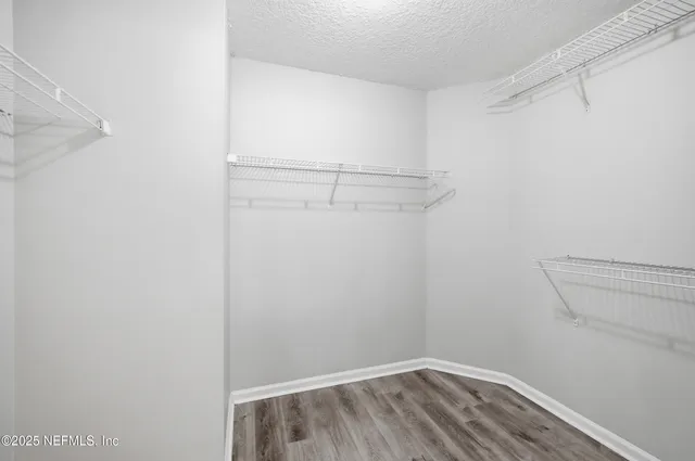 a view of a room with racks on the wall