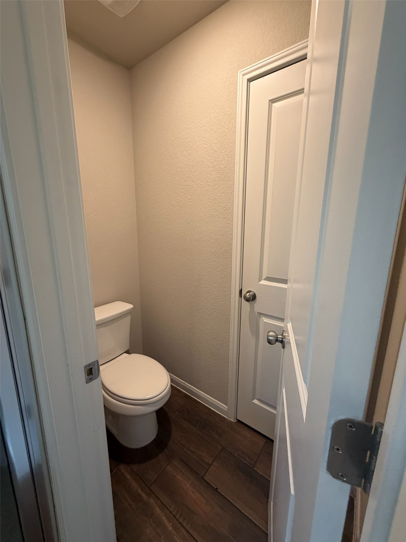 248 Falling Star Lane Georgetown, TX 78628 - Photo 13 of 16 A well-appointed water closet offers privacy and modern flooring for comfort.
