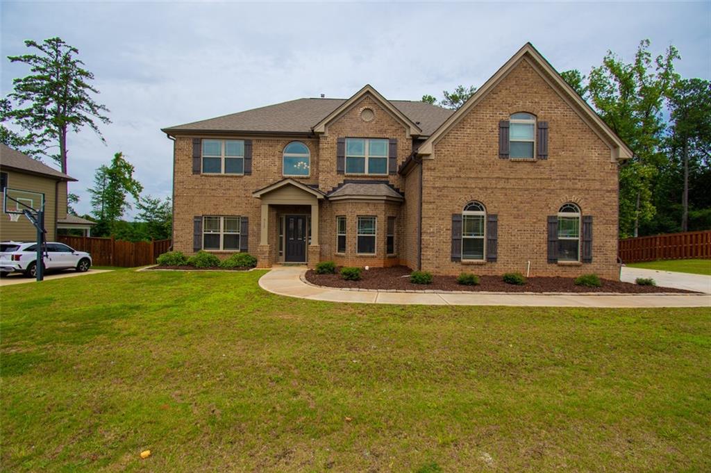 a front view of a house with a yard