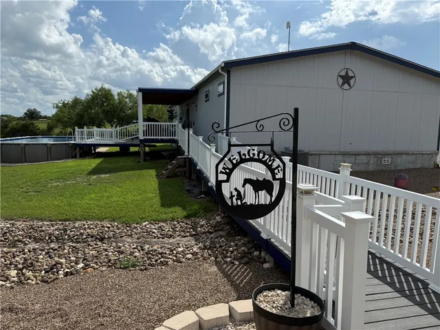a view of a garden with a building in the background