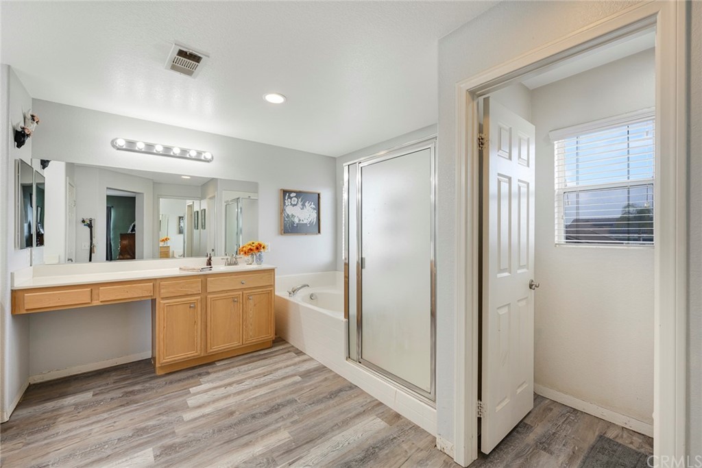 23571 Fallen Boulder Road Menifee, CA 92587 - Photo 29 of 33 a large white kitchen with a sink and refrigerator