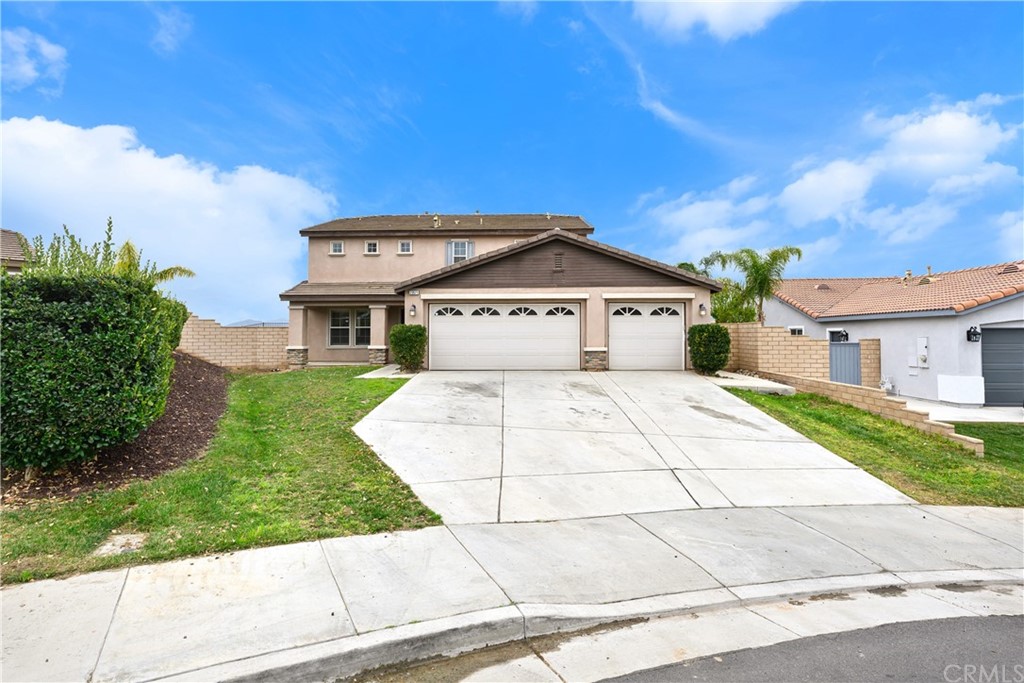 23571 Fallen Boulder Road Menifee, CA 92587 - Photo 3 of 33 a front view of a house with garden