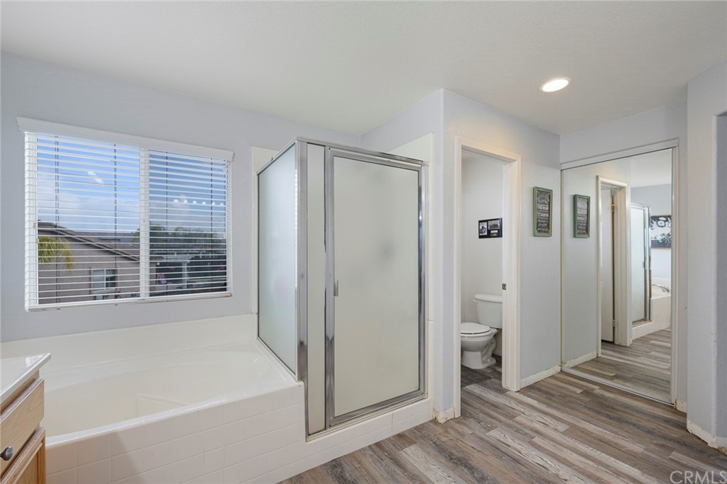 23571 Fallen Boulder Road Menifee, CA 92587 - Photo 31 of 33 a bathroom with a bathtub and a shower