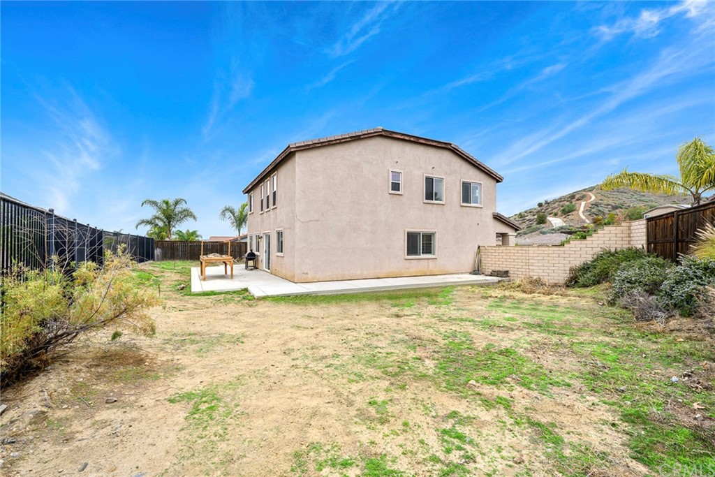 23571 Fallen Boulder Road Menifee, CA 92587 - Photo 6 of 33 a view of a house with a yard