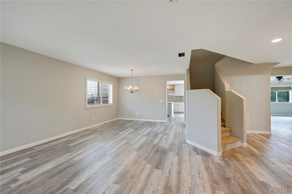 23571 Fallen Boulder Road Menifee, CA 92587 - Photo 9 of 33 a view of empty room with wooden floor and fan