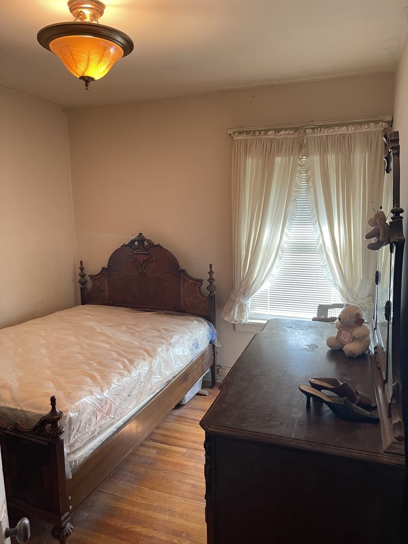 Undisclosed Address Chicago, IL 60643 - Photo 16 of 19 a bedroom with a bed and window