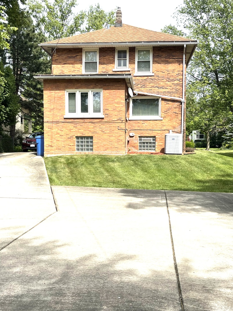 Undisclosed Address Chicago, IL 60643 - Photo 2 of 19 a view of a house with a yard and large tree