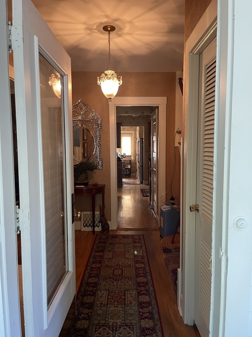 Undisclosed Address Chicago, IL 60643 - Photo 6 of 19 a view of a hallway with a livingroom and furniture