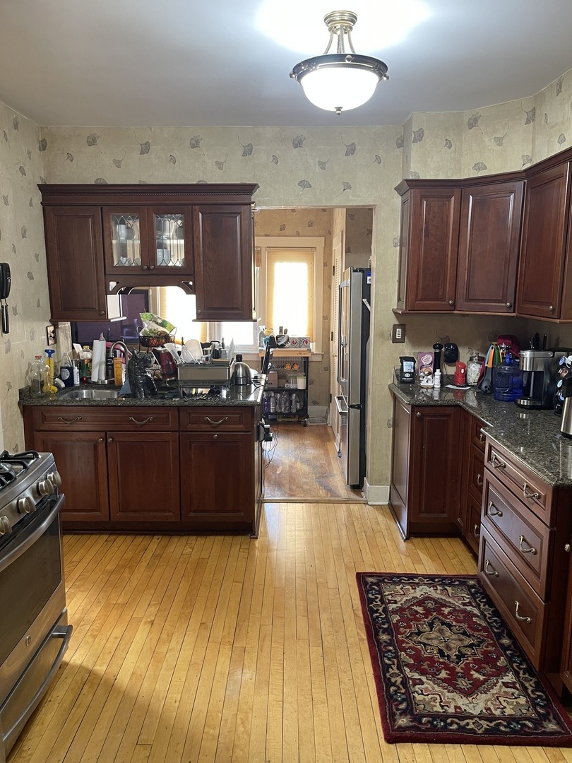 Undisclosed Address Chicago, IL 60643 - Photo 8 of 19 a kitchen with granite countertop stainless steel appliances and wooden cabinets