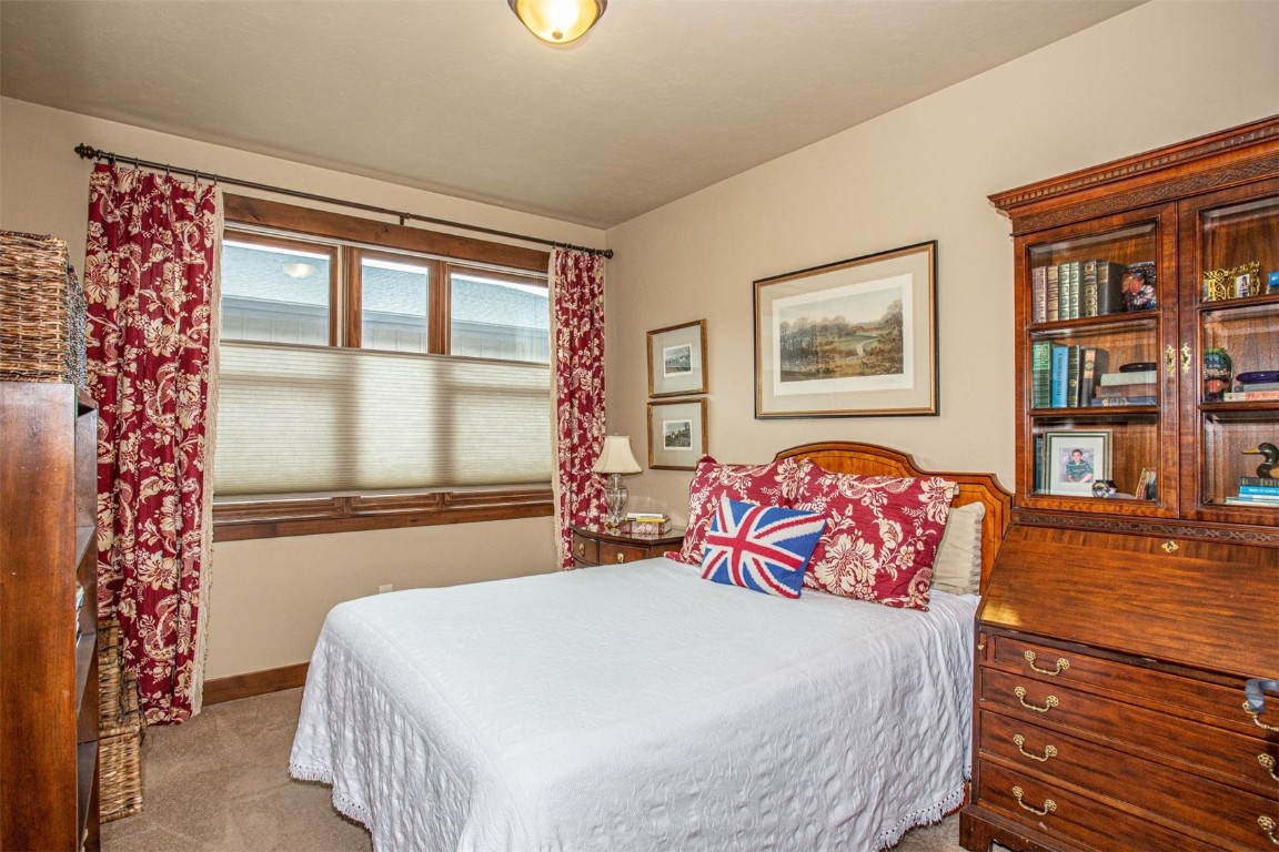 421 Rainbow Drive, Unit 5 Silverthorne, CO 80498 - Photo 25 of 36 a bedroom with a large bed and a window