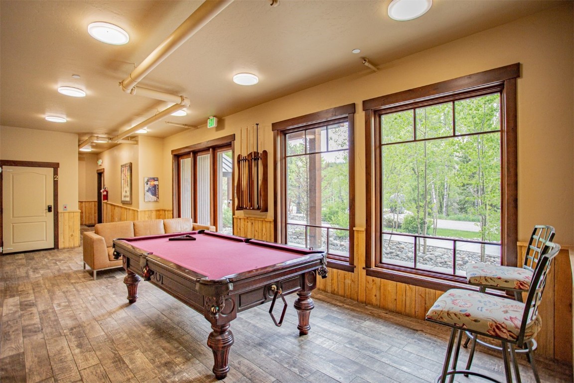 421 Rainbow Drive, Unit 5 Silverthorne, CO 80498 - Photo 31 of 36 a bedroom with furniture and large window