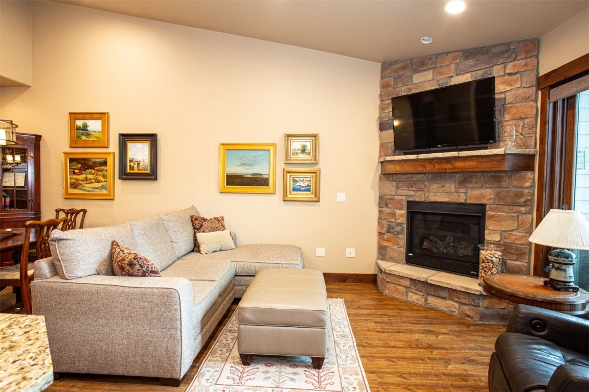 421 Rainbow Drive, Unit 5 Silverthorne, CO 80498 - Photo 8 of 36 a living room with furniture and a fireplace