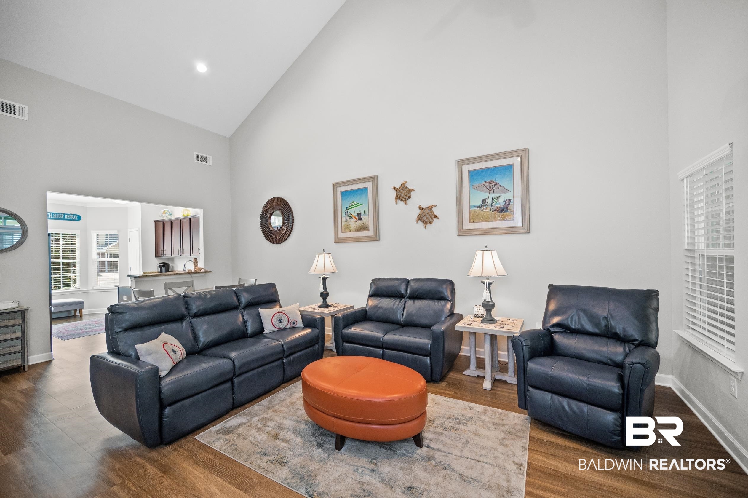 430 West Fort Morgan Road, Unit 1902 Gulf Shores, AL 36542 - Photo 4 of 59 Living room featuring hardwood / wood-style floors and high vaulted ceiling