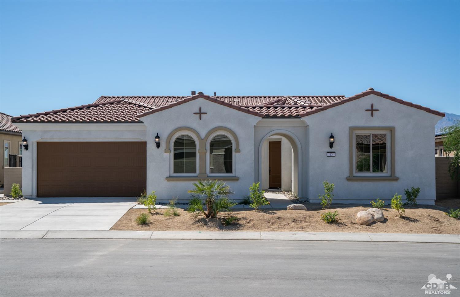 15 Riesling Rancho Mirage, CA 92270 - Photo 1 of 17 a front view of a house with a garden