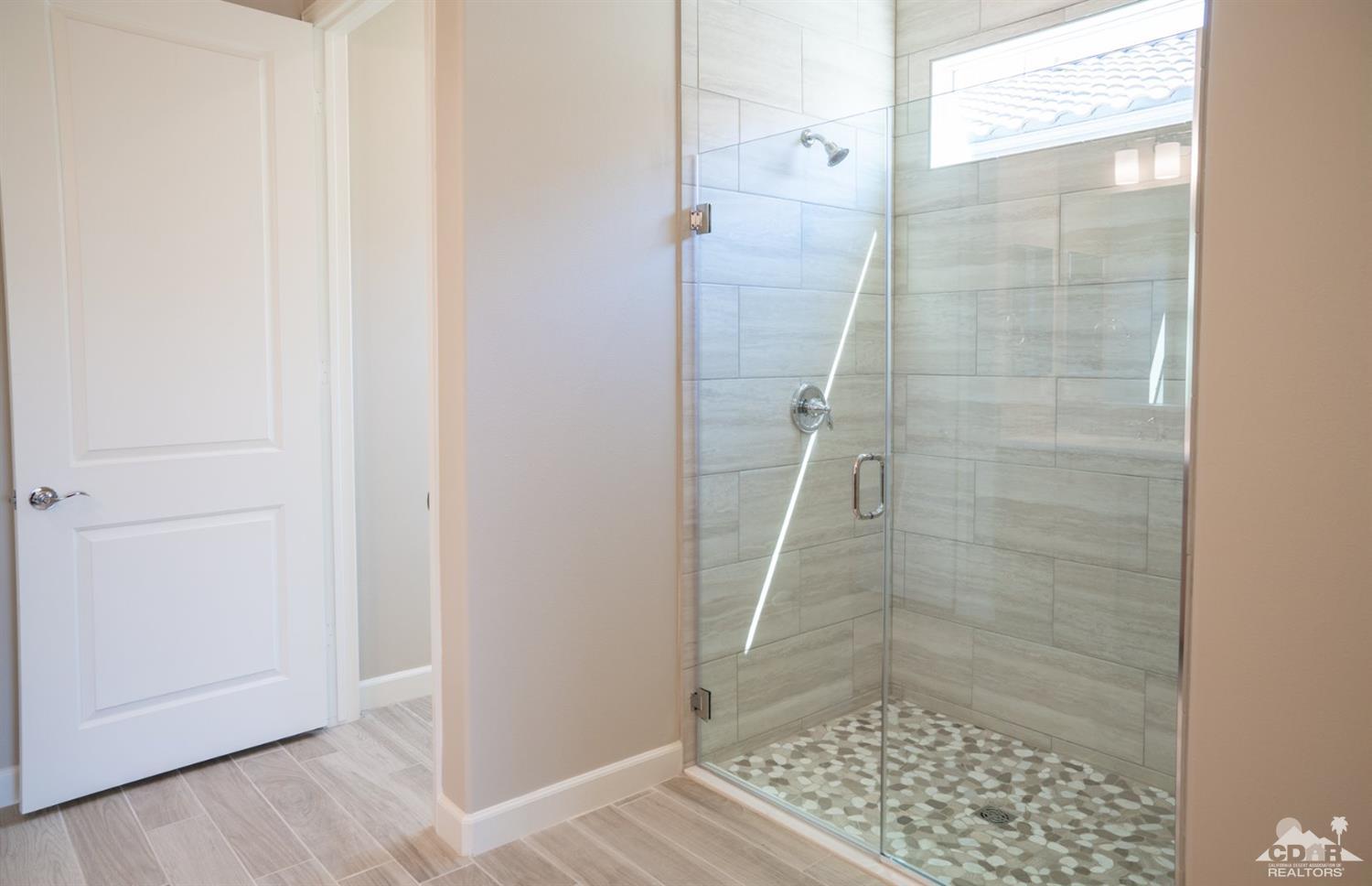 15 Riesling Rancho Mirage, CA 92270 - Photo 3 of 17 a bathroom with a shower