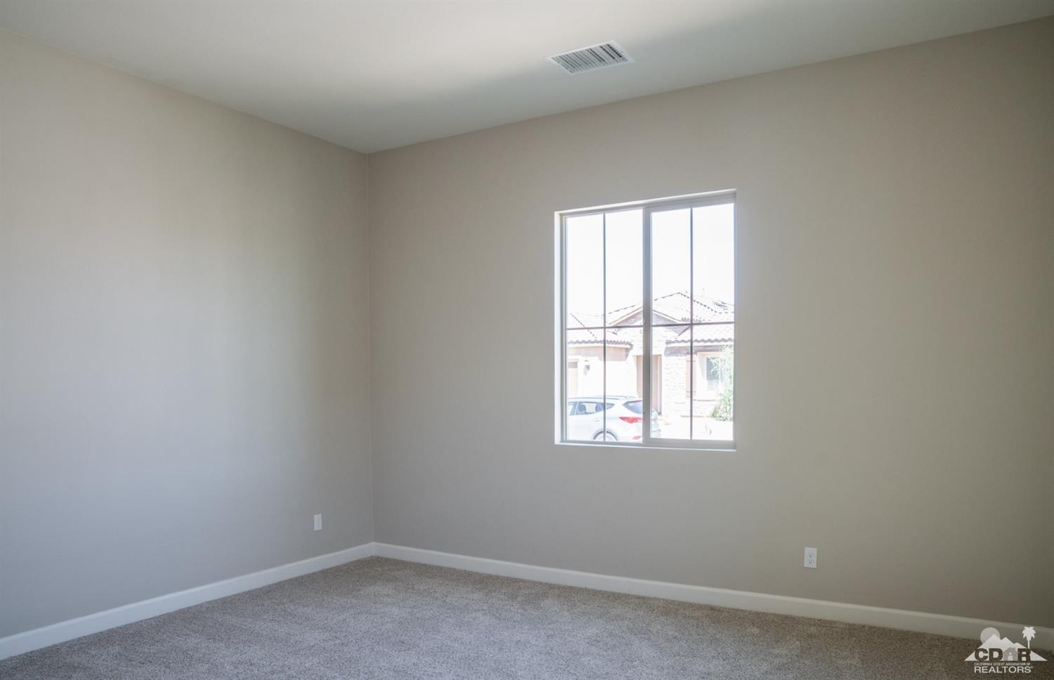 15 Riesling Rancho Mirage, CA 92270 - Photo 6 of 17 an empty room with a window