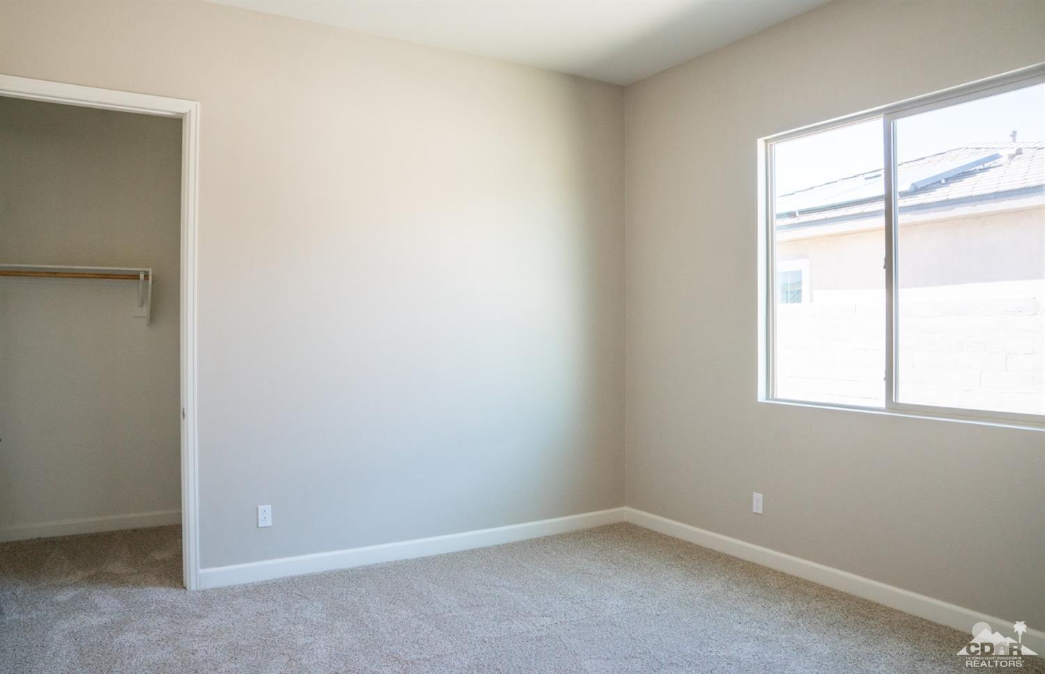 15 Riesling Rancho Mirage, CA 92270 - Photo 7 of 17 an empty room with a window