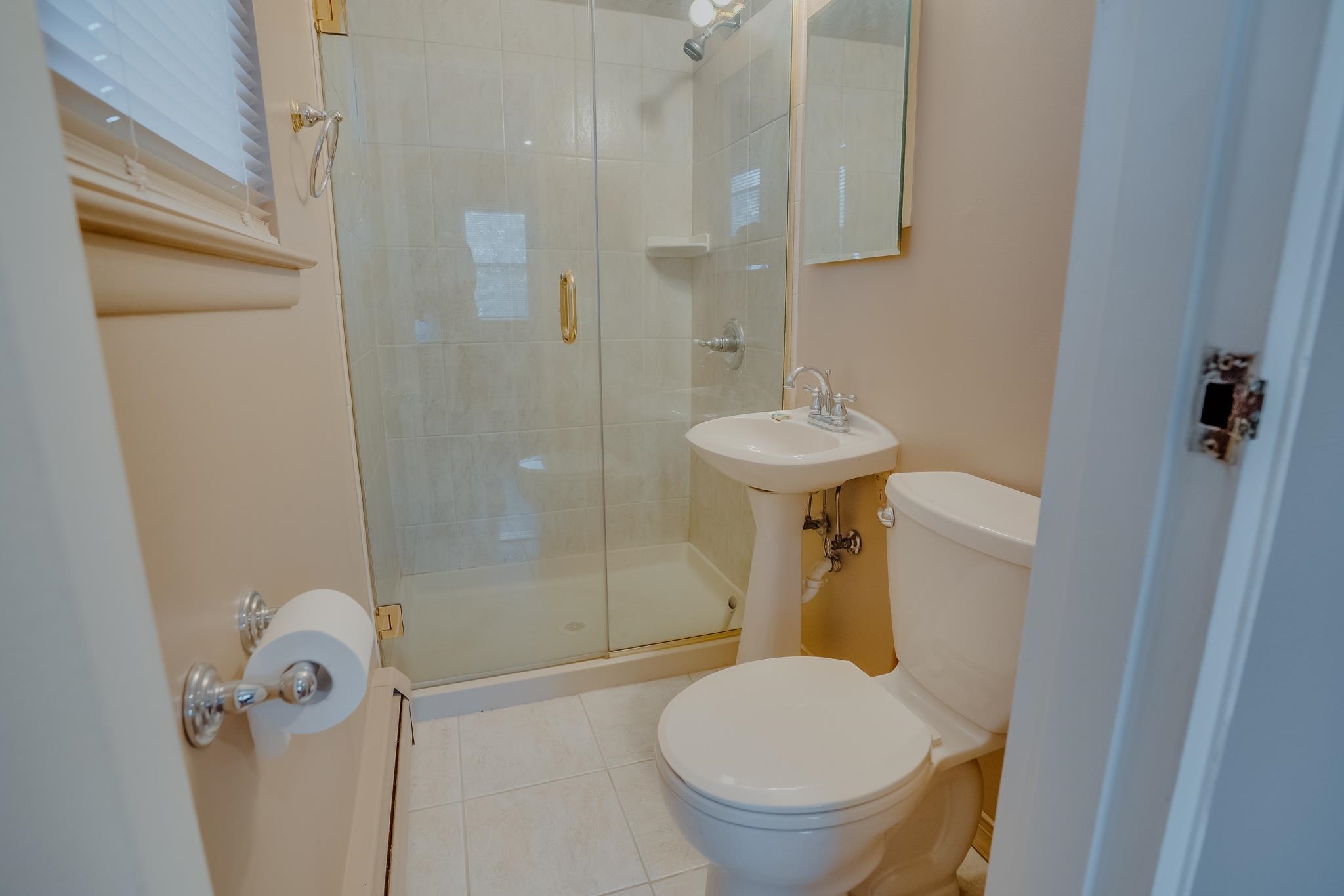 1138F Farm Road, Unit D Secaucus, NJ 07094 - Photo 5 of 10 a bathroom with a sink toilet and shower