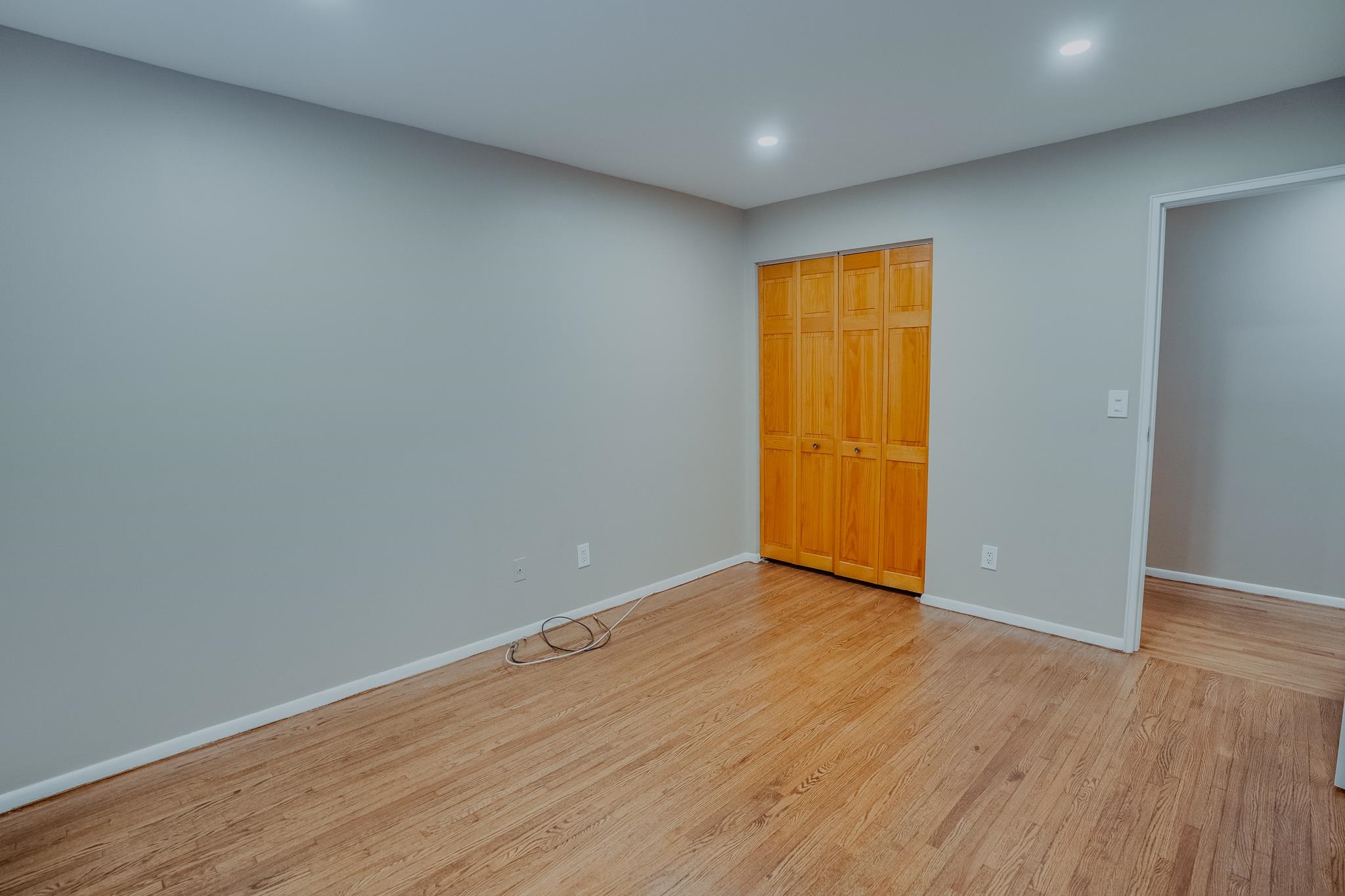 1138F Farm Road, Unit D Secaucus, NJ 07094 - Photo 8 of 10 a view of an empty room with wooden floor