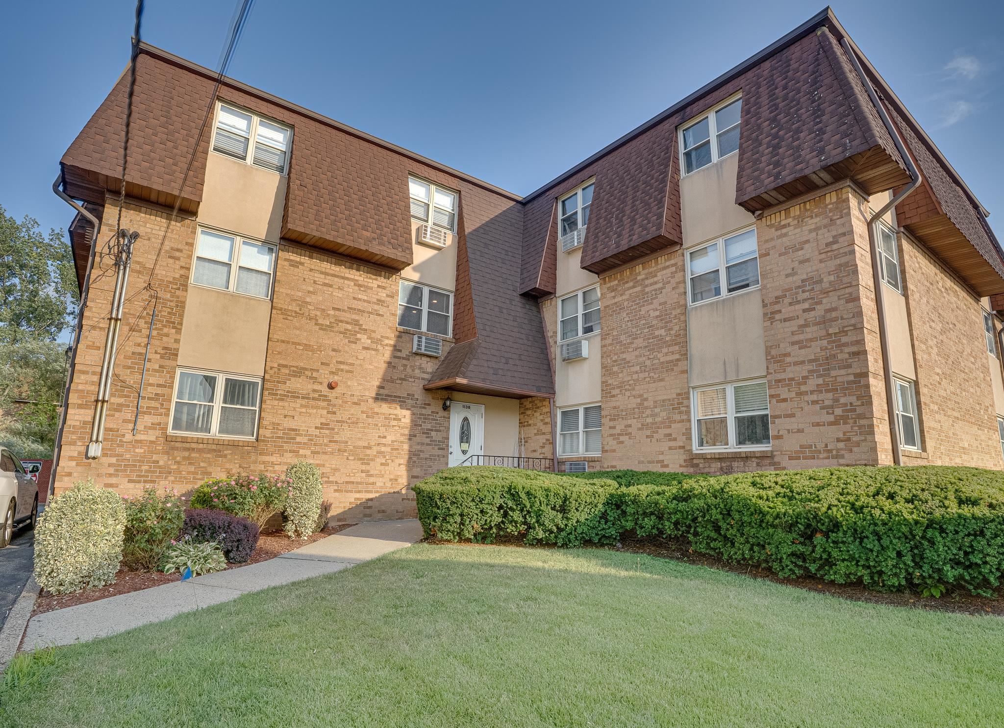 1138F Farm Road, Unit D Secaucus, NJ 07094 - Photo 10 of 10 a view of a brick house with a yard