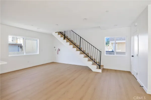 a view of an entryway with wooden floor