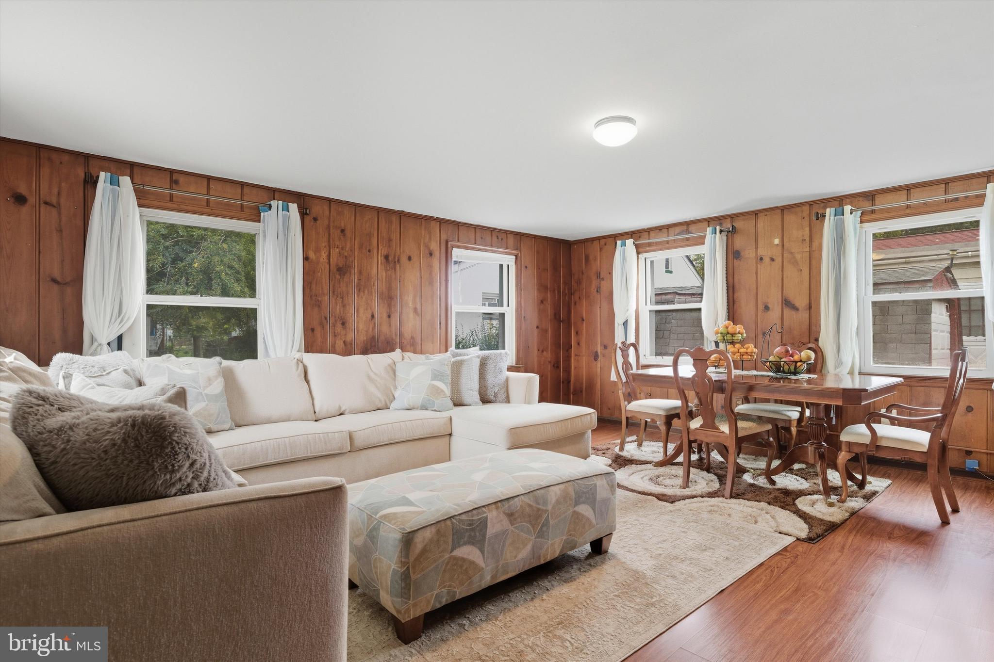 5024 Addison Road Capitol Heights, MD 20743 - Photo 11 of 23 a living room with furniture and large windows