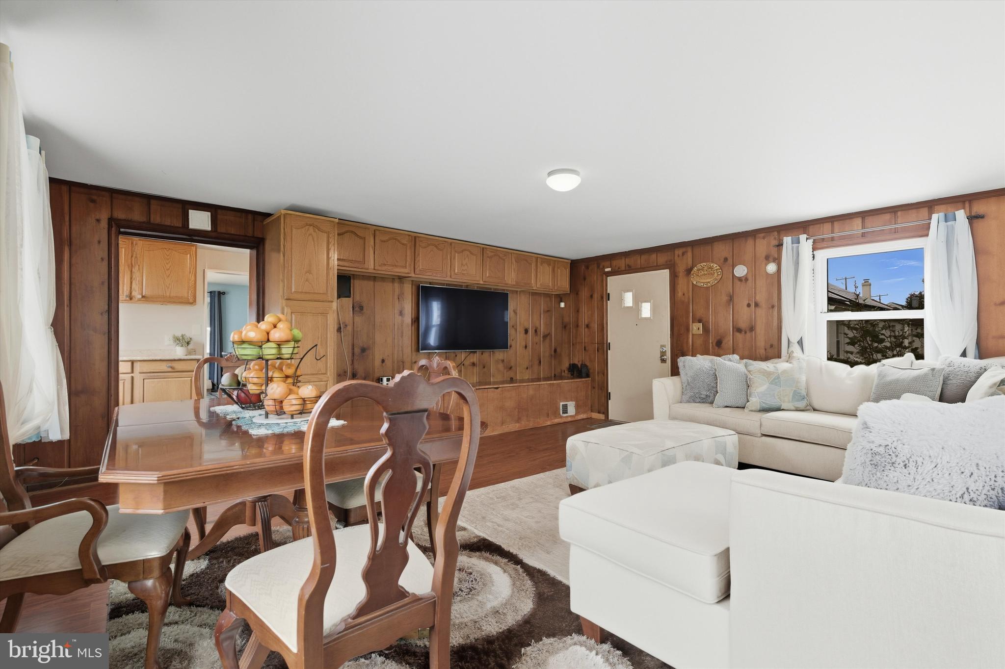 5024 Addison Road Capitol Heights, MD 20743 - Photo 12 of 23 a living room with furniture and a flat screen tv