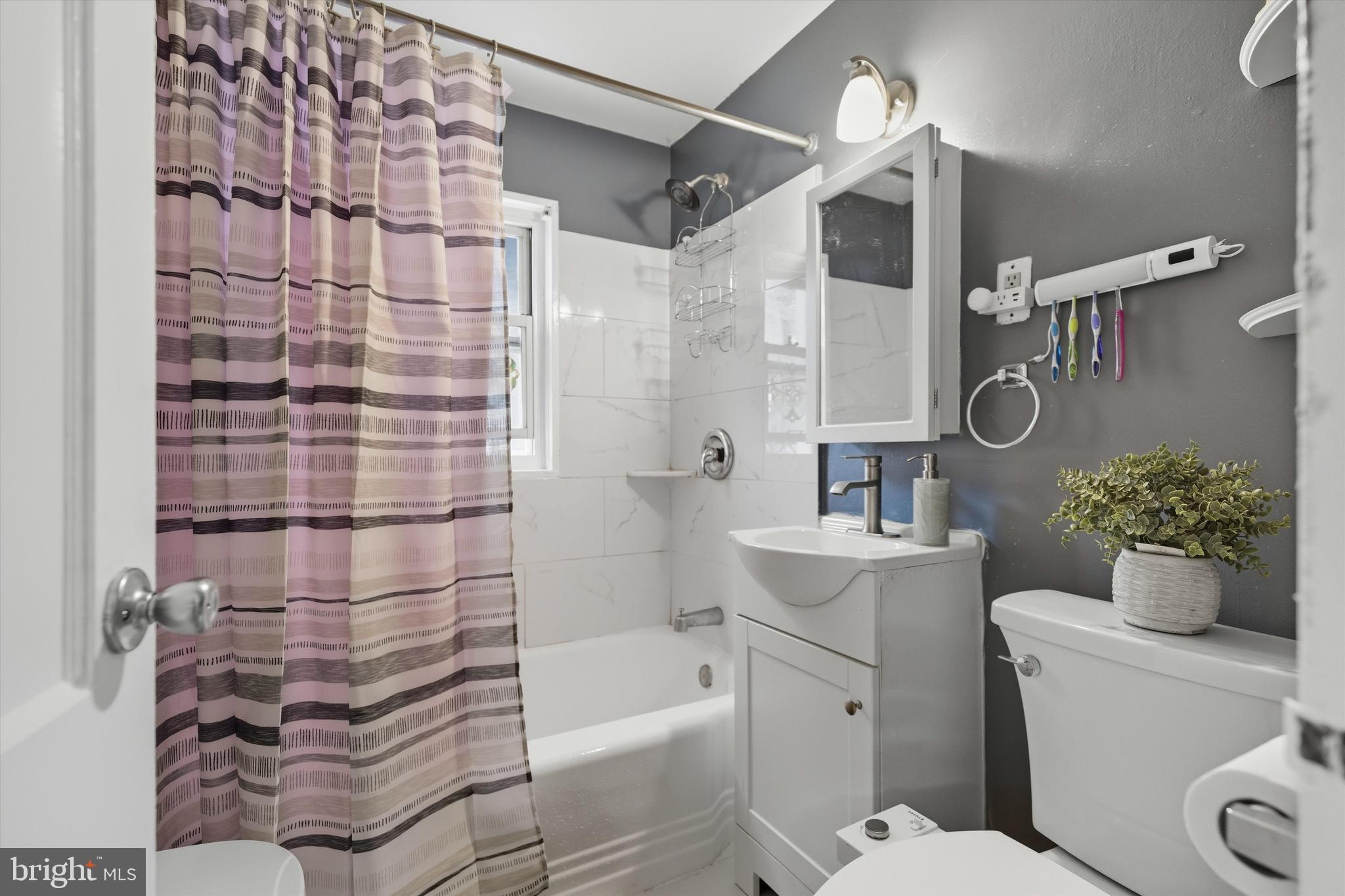 5024 Addison Road Capitol Heights, MD 20743 - Photo 15 of 23 a bathroom with a sink toilet and shower