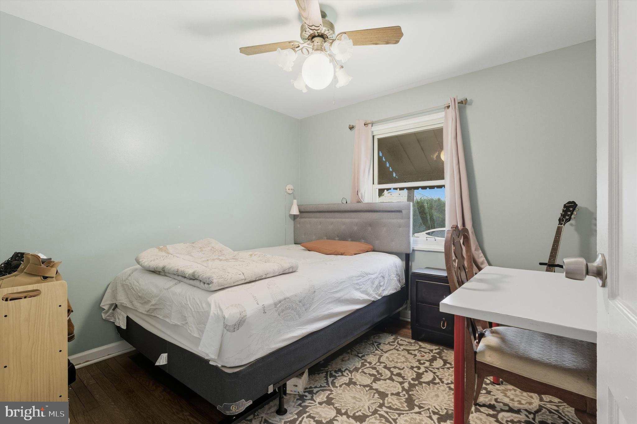 5024 Addison Road Capitol Heights, MD 20743 - Photo 18 of 23 a bedroom with a bed and dresser