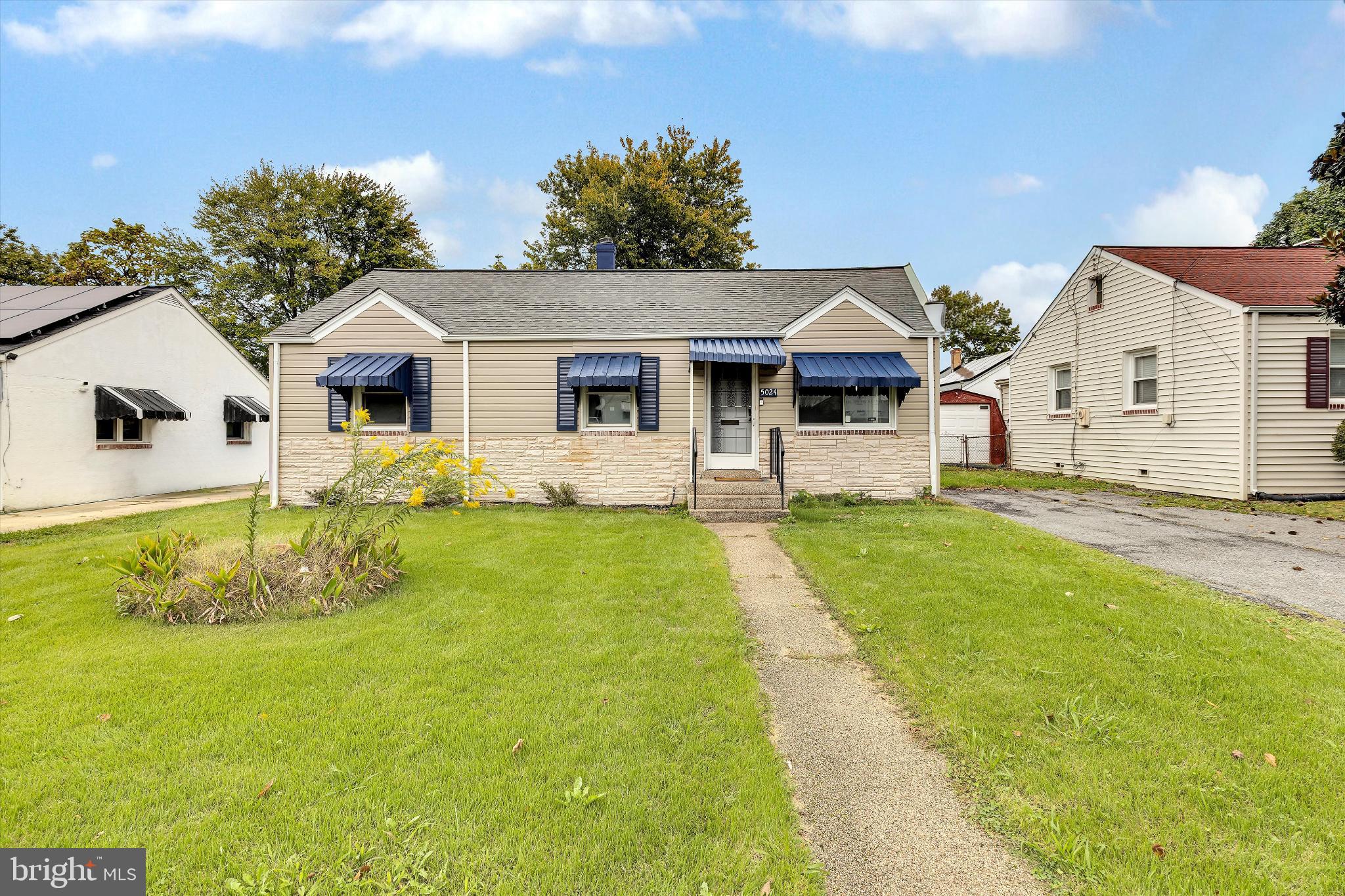 5024 Addison Road Capitol Heights, MD 20743 - Photo 2 of 23 a front view of a house with yard and green space