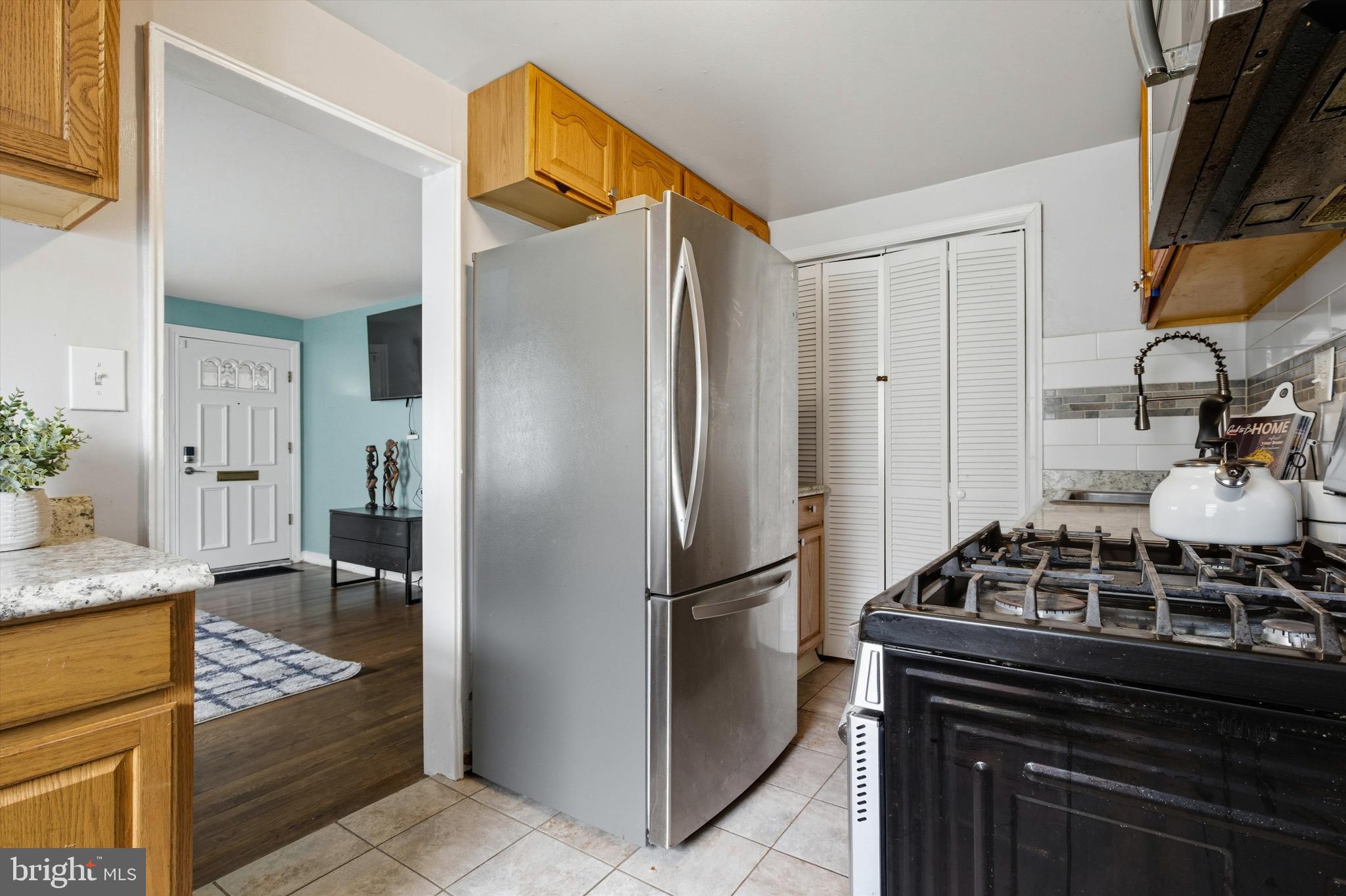 5024 Addison Road Capitol Heights, MD 20743 - Photo 7 of 23 a kitchen with stainless steel appliances granite countertop a refrigerator and a stove