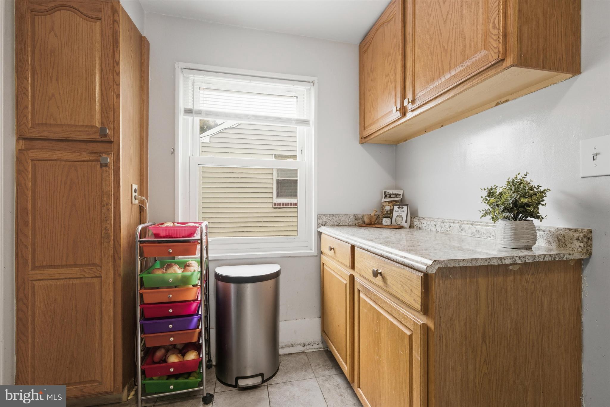 5024 Addison Road Capitol Heights, MD 20743 - Photo 8 of 23 a kitchen with stainless steel appliances granite countertop a sink and a refrigerator