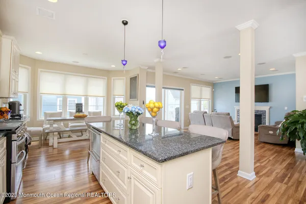 a kitchen with counter space dining table and chairs