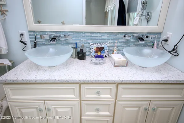 a view of sink and mirror