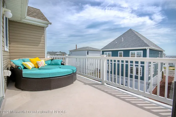 a view of a house with backyard outdoor seating and barbeque oven