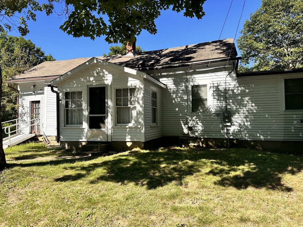 56 Lombard Road Hubbardston, MA 01452 - Photo 1 of 29 a view of a house with a small yard