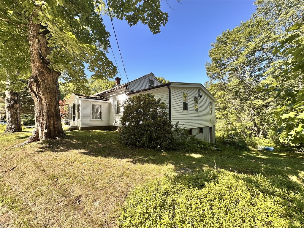 56 Lombard Road Hubbardston, MA 01452 - Photo 2 of 29 a view of a house with a yard