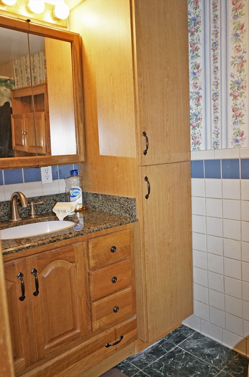 56 Lombard Road Hubbardston, MA 01452 - Photo 21 of 29 a bathroom with a sink and a mirror