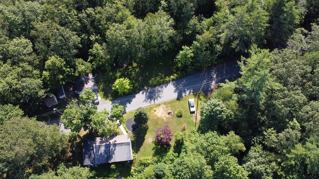 56 Lombard Road Hubbardston, MA 01452 - Photo 26 of 29 an aerial view of a house with a yard and garden