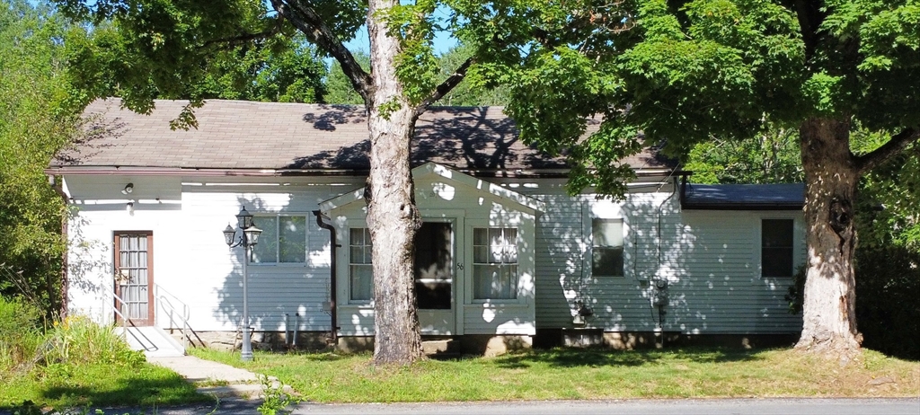 56 Lombard Road Hubbardston, MA 01452 - Photo 3 of 29 a view of a house with a tree in a yard