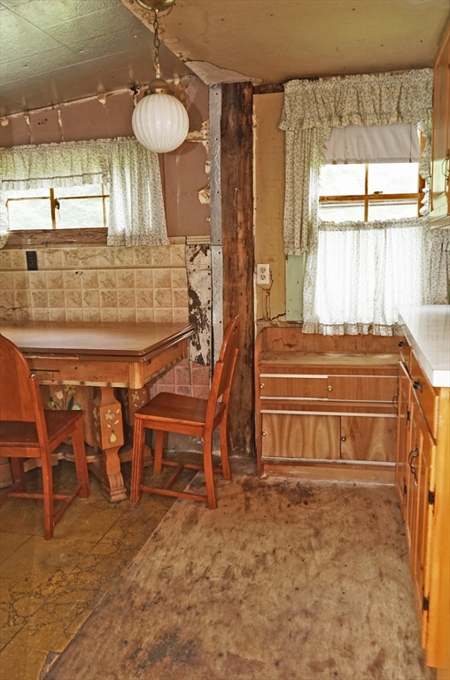56 Lombard Road Hubbardston, MA 01452 - Photo 8 of 29 a bedroom with a bed and a chandelier