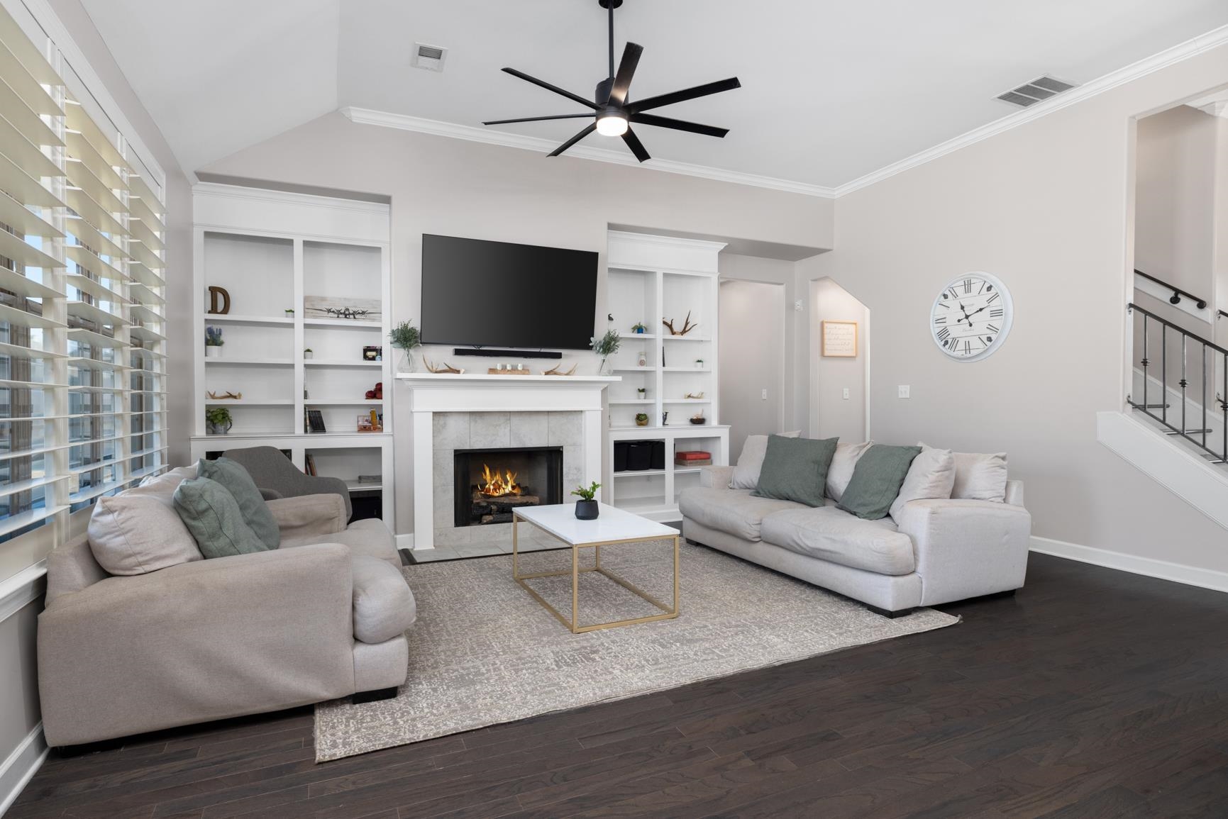 235 Misty Fields Road Oakland, TN 38060 - Photo 11 of 40 a living room with furniture a fireplace and a flat screen tv