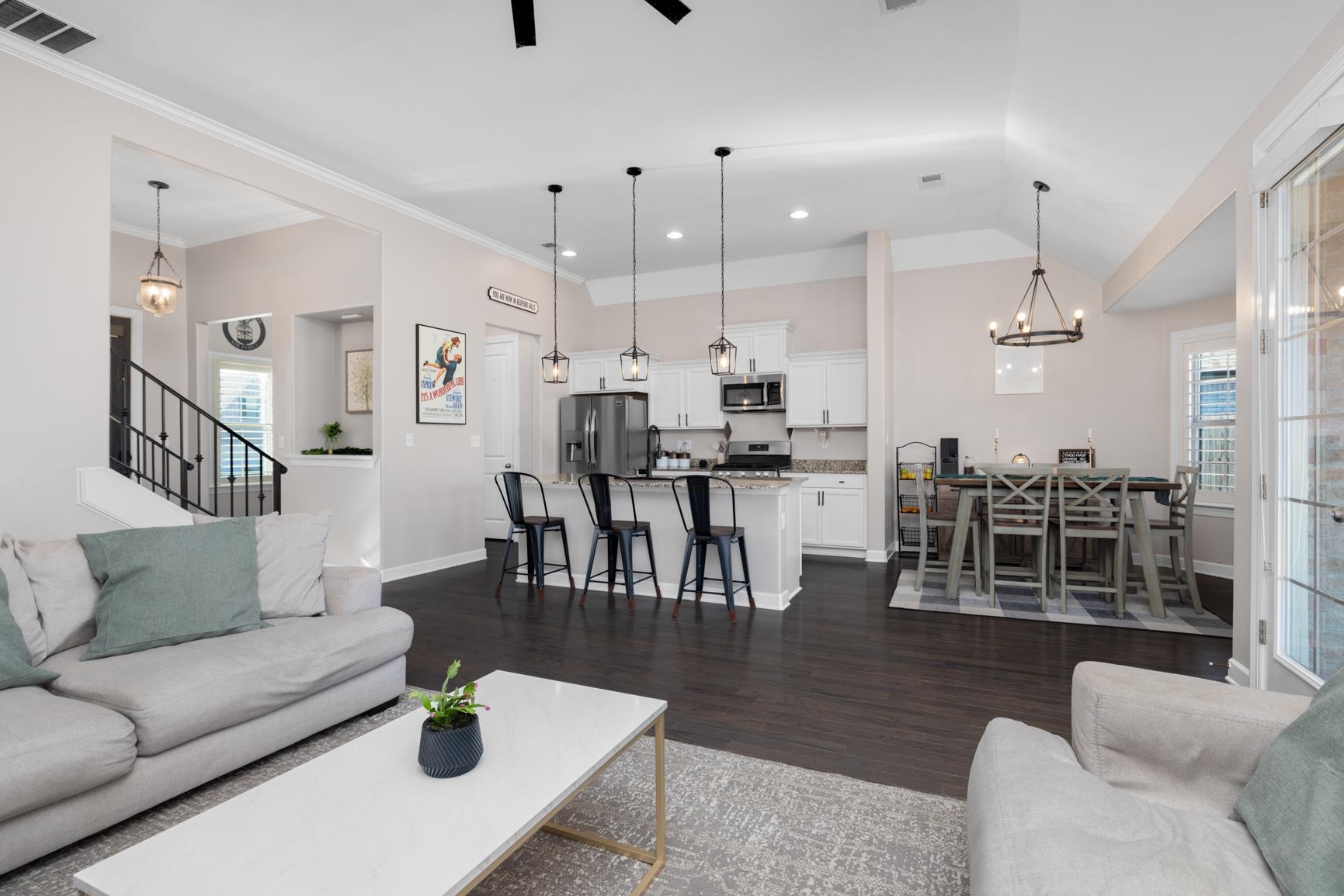 235 Misty Fields Road Oakland, TN 38060 - Photo 13 of 40 a living room with furniture kitchen view and a wooden floor