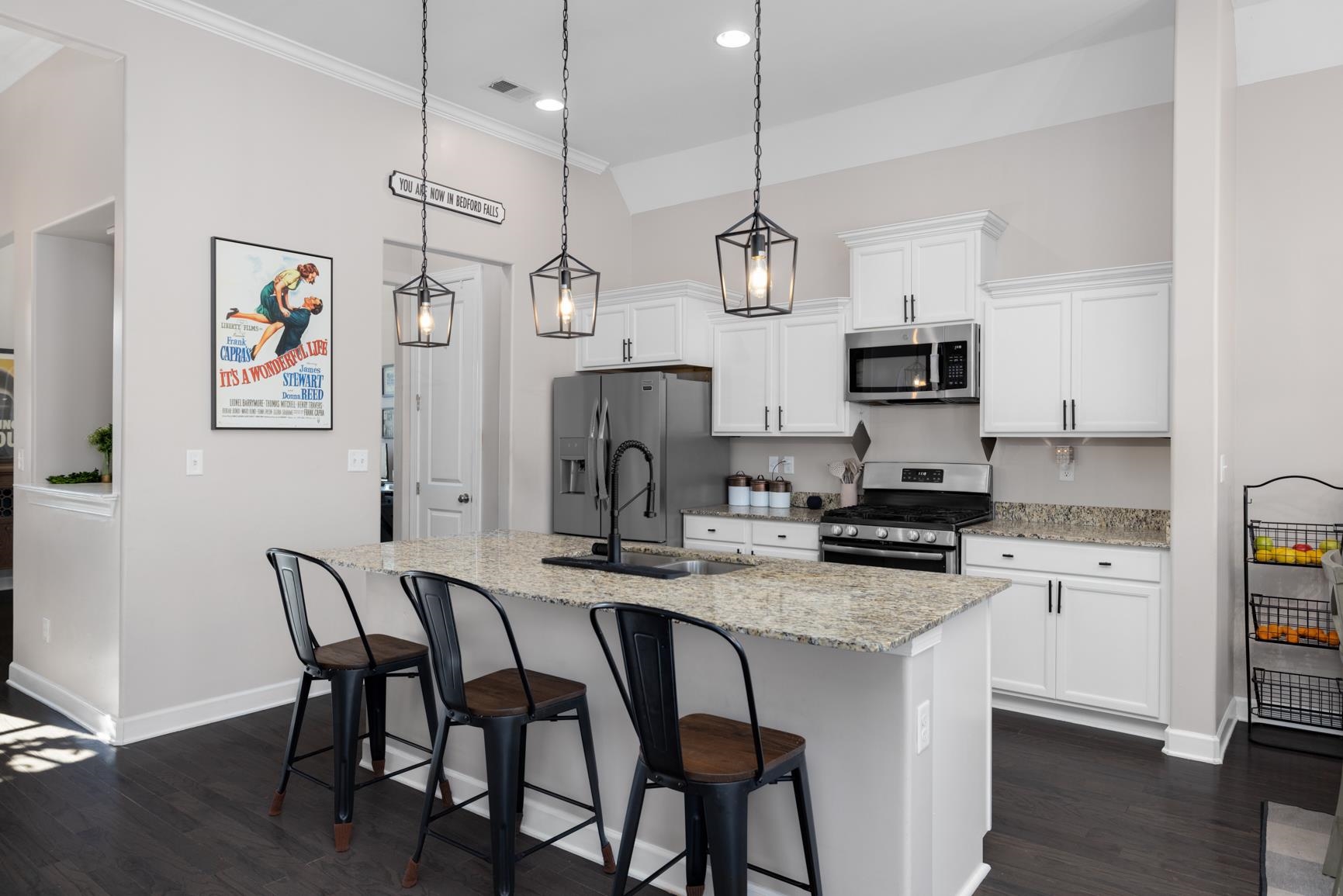 235 Misty Fields Road Oakland, TN 38060 - Photo 17 of 40 a kitchen with stainless steel appliances granite countertop a stove a refrigerator a kitchen island a sink and a refrigerator
