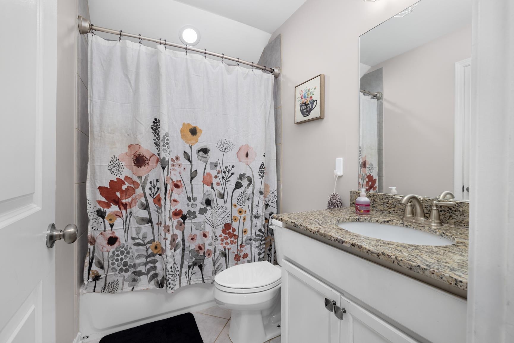 235 Misty Fields Road Oakland, TN 38060 - Photo 35 of 40 a bathroom with a granite countertop sink toilet and shower