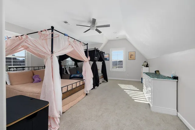 a view of a livingroom with furniture and staircase